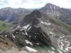 Looking down Wetterhorn&rsquo;s 4th class east ridge toward Matterhorn Peak, with Uncompahgre Peak in the background